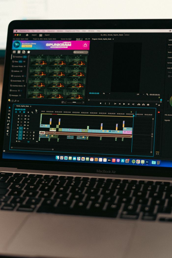 about-02 Close-up of video editing software on a MacBook Air screen, showcasing a digital workspace.